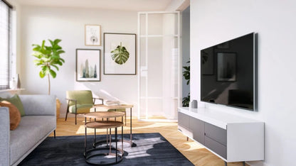 Slika Vogels TVM 3405, ki prikazuje OLED televizor (32-77"), pritrjen na steno, kar omogoča varno in stabilno namestitev.